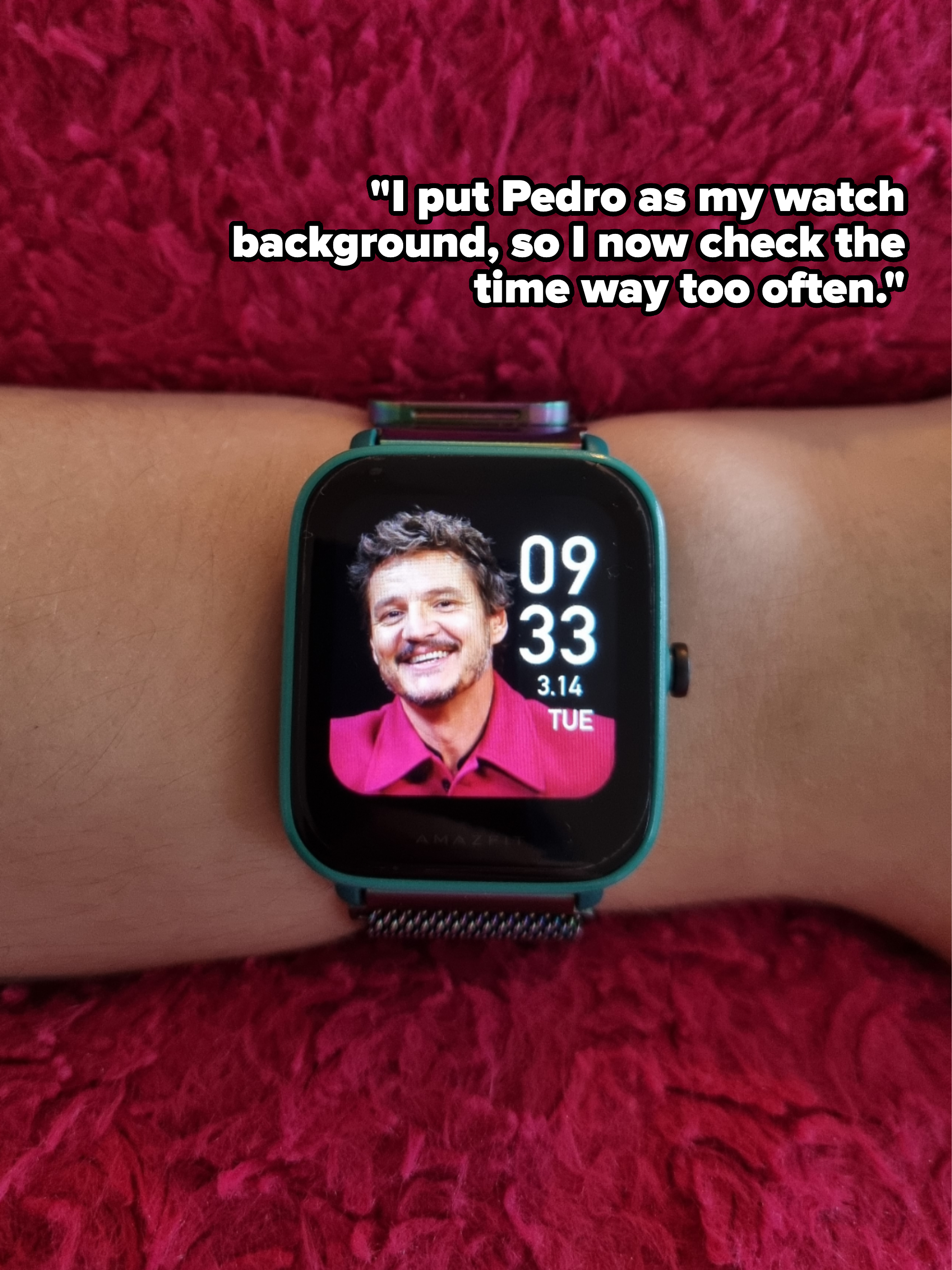 Smartwatch on wrist showing a picture of smiling man and displaying time 09:33, date 3.14 Tuesday