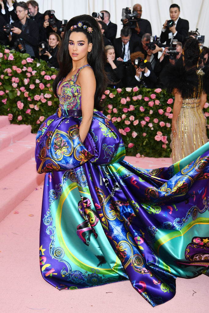 Kylie Jenner in a voluminous, patterned gown with a long train at a gala event