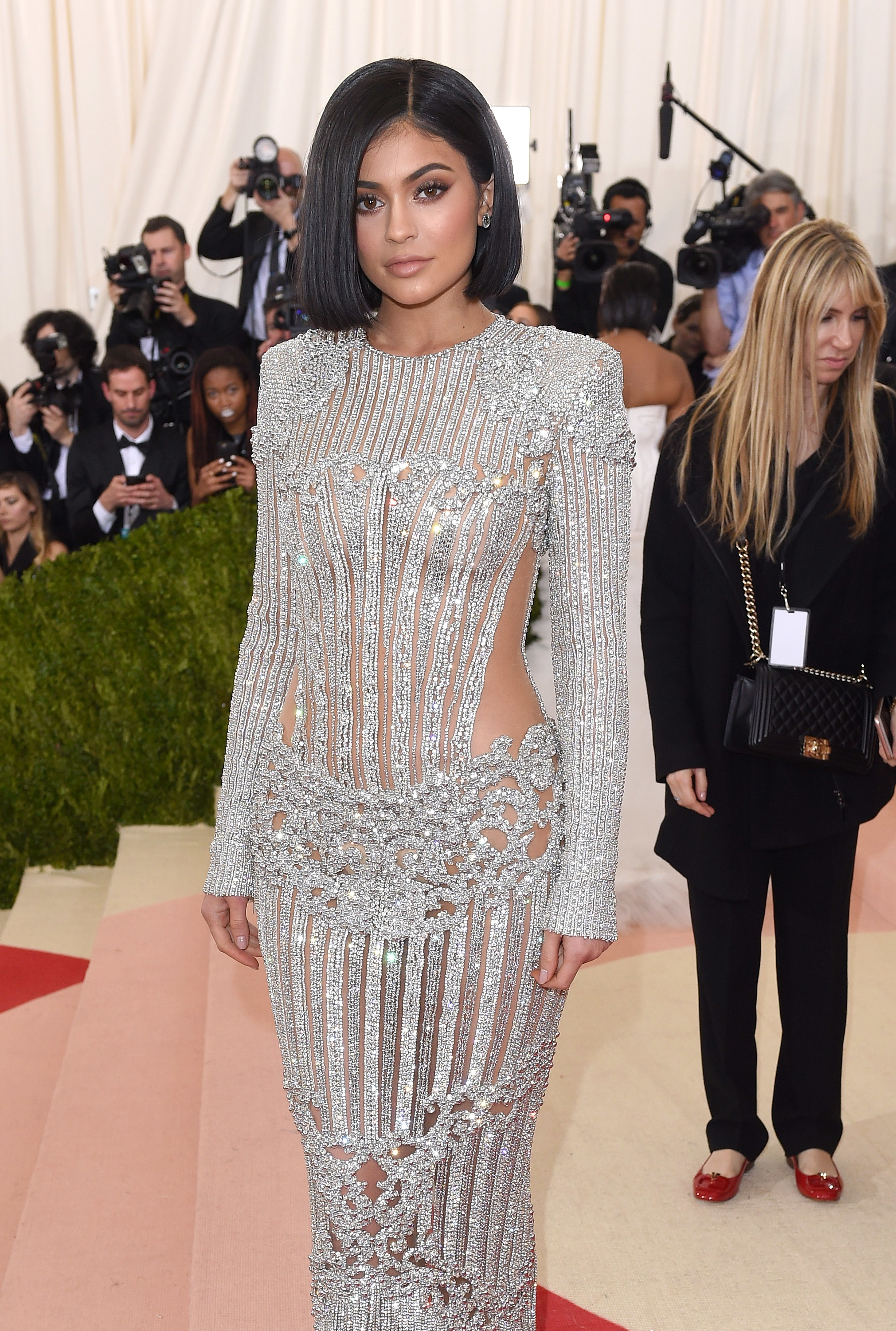 Kylie Jenner in a sparkling, embellished gown with cut-outs at a gala event