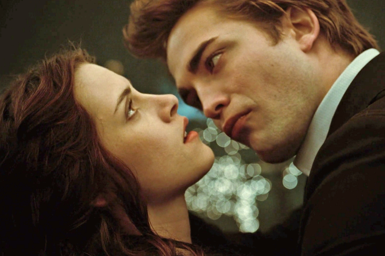 Edward and Bella from Twilight face close together, expressing intense emotions