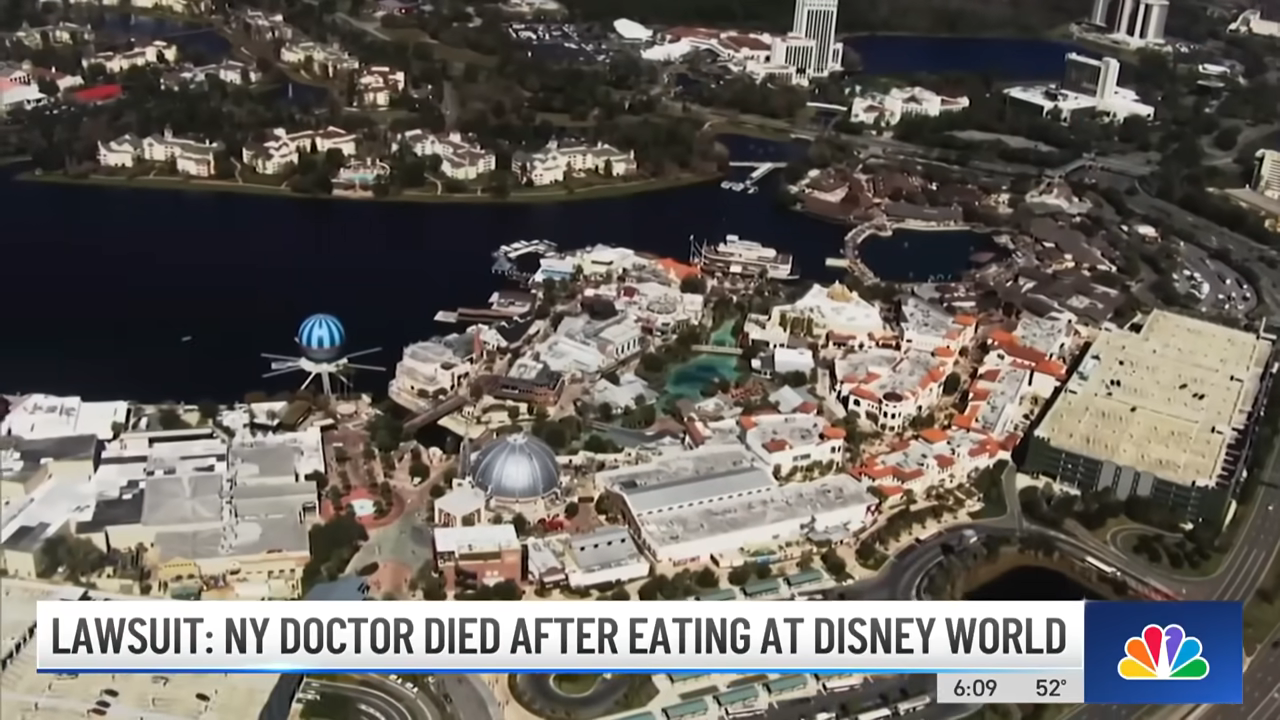 Aerial view of Disney World with a news banner about a NY doctor&#x27;s death after eating there