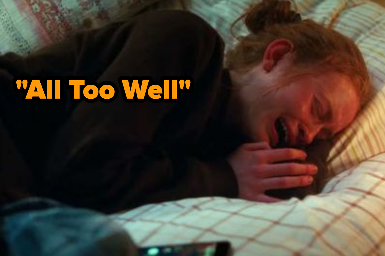 Scene from "All Too Well" showing a woman lying on a bed crying