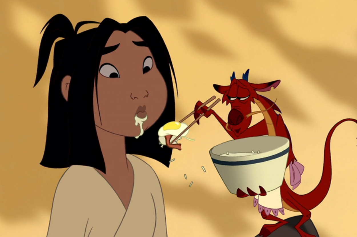 Mushu feeding Mulan some breakfast with chopsticks