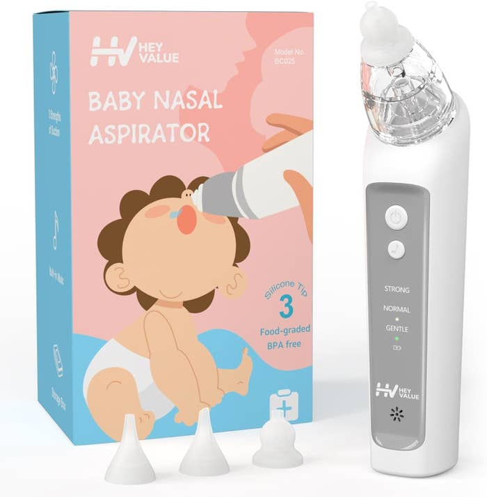 Baby nasal aspirator product with three silicone tips next to its packaging, depicting a baby using the device