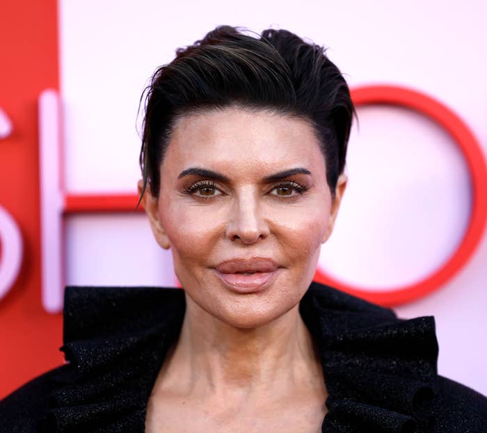 A closeup of Lisa Rinna who&#x27;s hair is slicked back