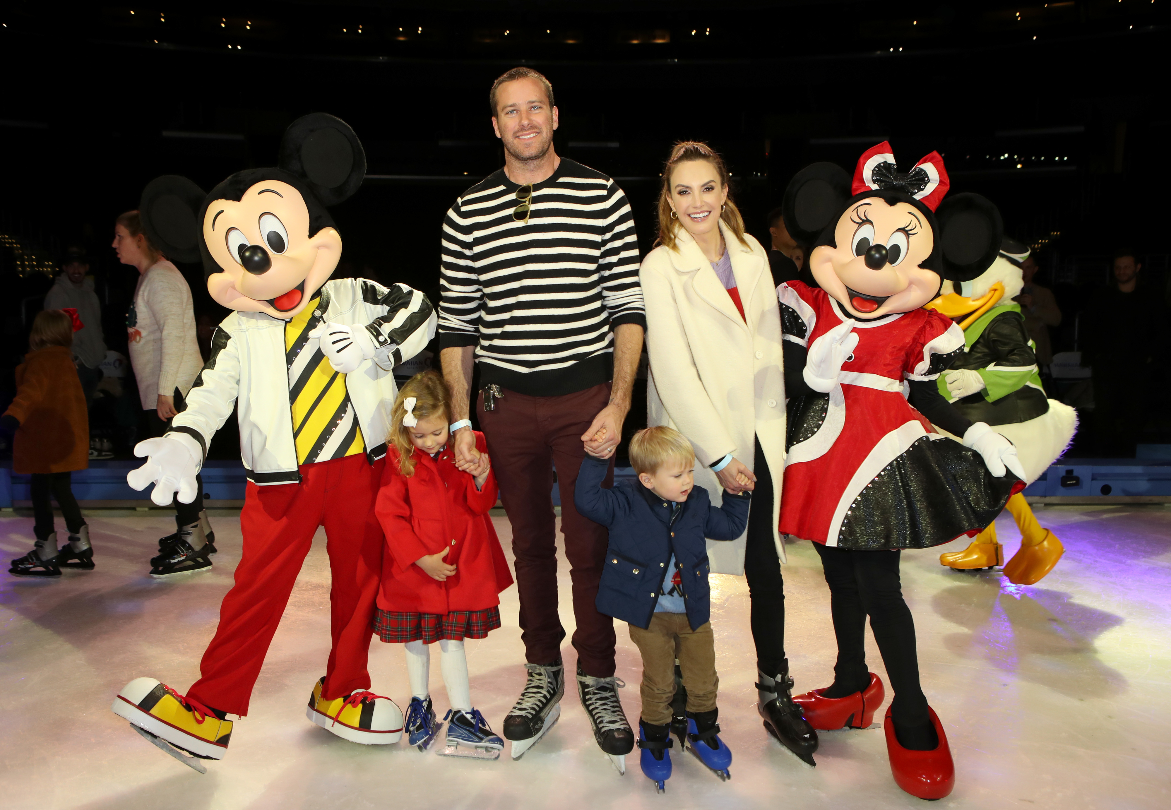 Elizabeth Chambers and Armie Hammer with their kids, Harper and Ford, and Mickey and Minnie Mouse