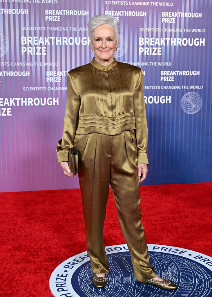Glenn Close wearing a gold pantsuit with a cinched waist on the Breakthrough Prize red carpet