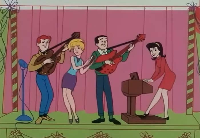 Animated characters playing music; two with guitars, one singing, and one at a piano