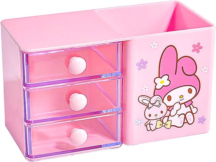 A pink storage box with a bunny printed on it