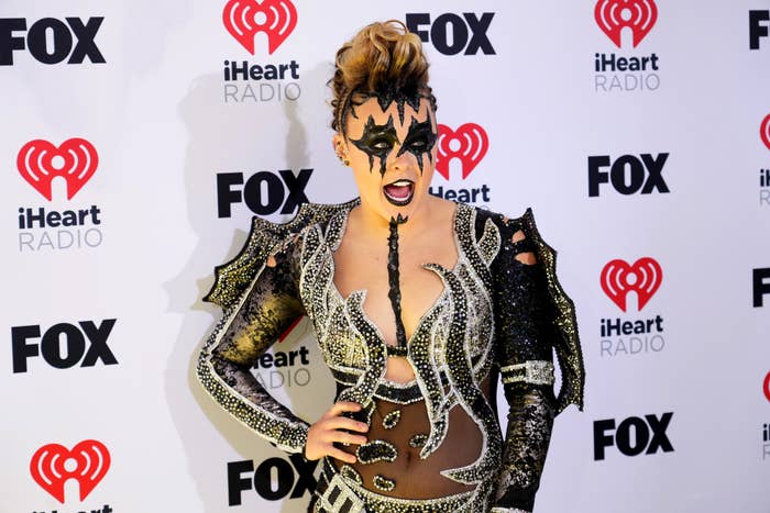 JoJo Siwa in an elaborate costume with face paint at the iHeartRadio event