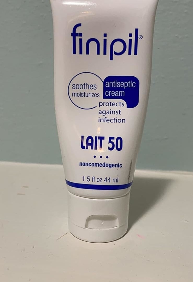 Reviewer&#x27;s phot of a tube of Finipil Lait 50 lotion, used to soothe and protect skin post hair removal