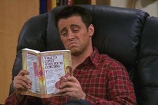 Joey from Friends looks confused reading 