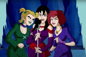 Animated characters from the show "Scooby-Doo" the Hex Girls singing into a microphone.