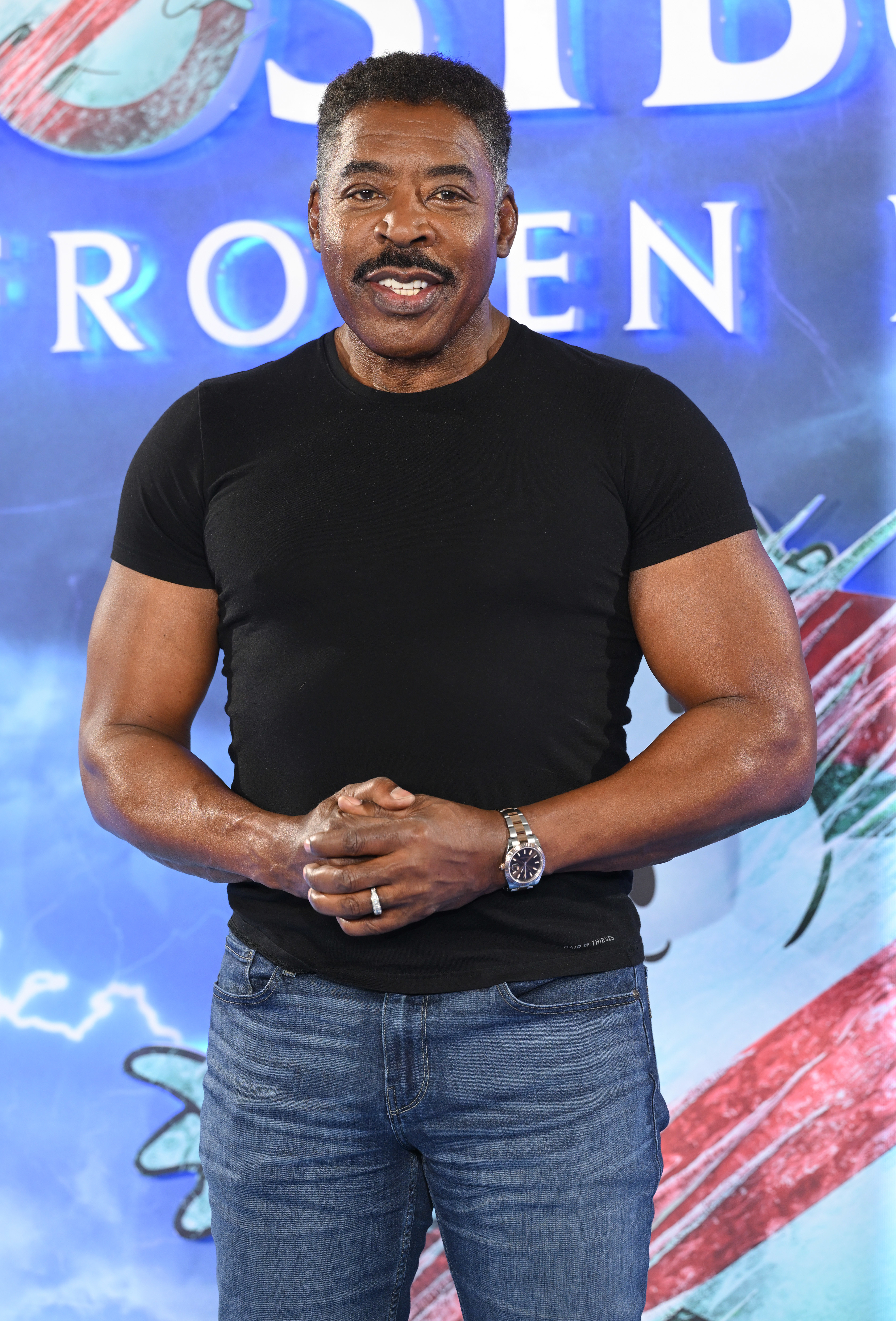 Ernie Hudson posing in a black fitted t-shirt at a &quot;Ghostbusters: Afterlife&quot; promotional event