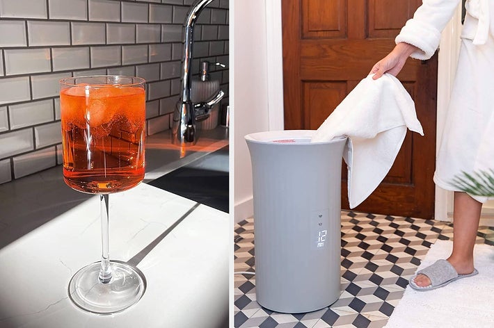 reviewer's square wine glass filled with orange beverage / person pulling towel out of warmer