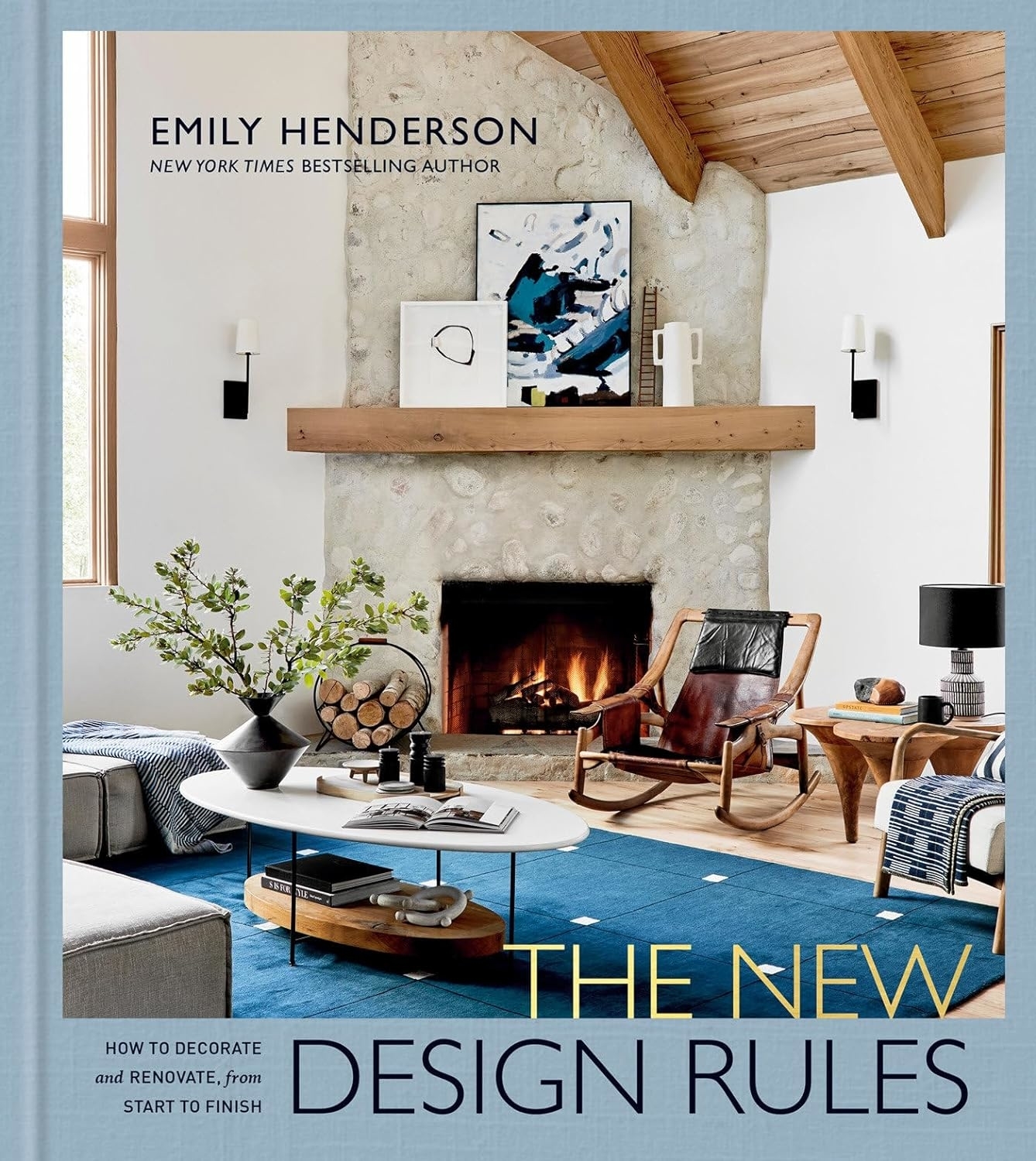 Cover of &quot;The New Design Rules&quot; by Emily Henderson, showcasing a well-decorated room with furniture and fireplace