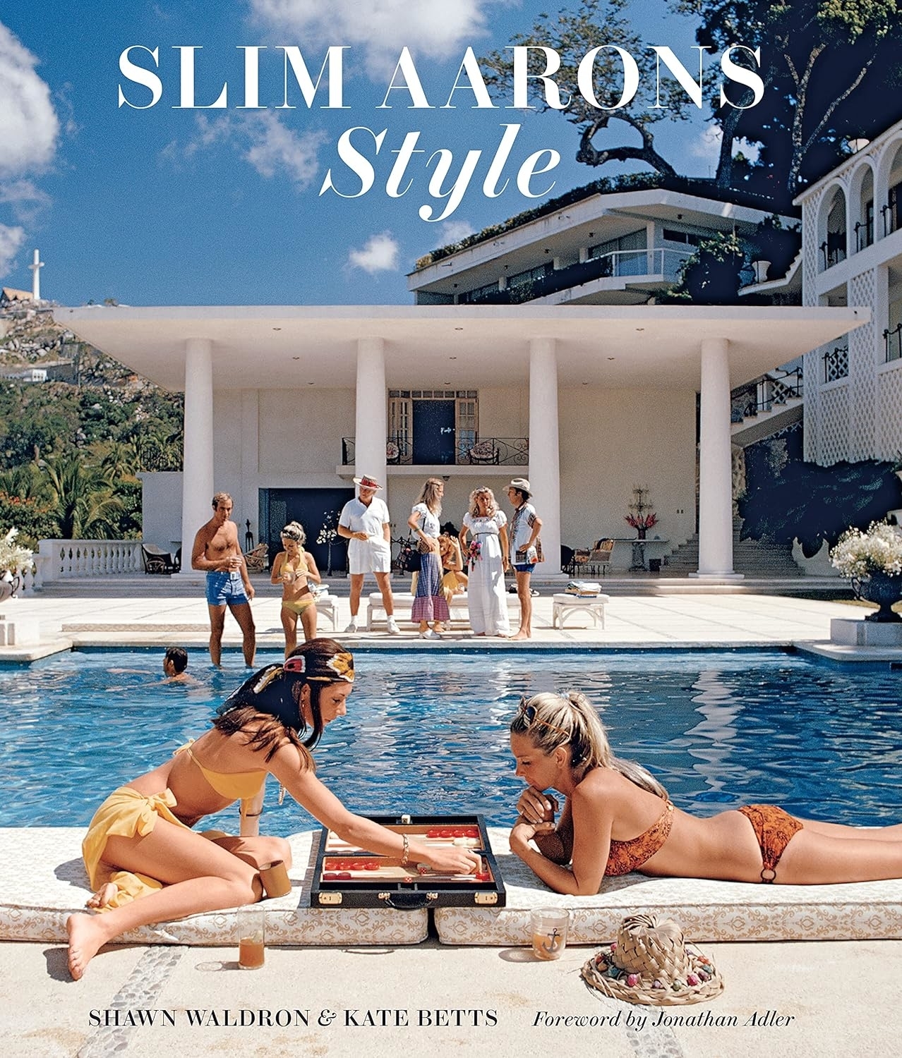 Book cover of &quot;Slim Aarons: Style&quot; showing people by a pool playing games and socializing