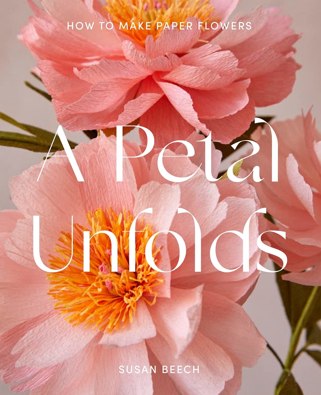Book cover titled &quot;A Petal Unfolds&quot; by Susan Beech, displaying paper flowers and a guide on crafting them
