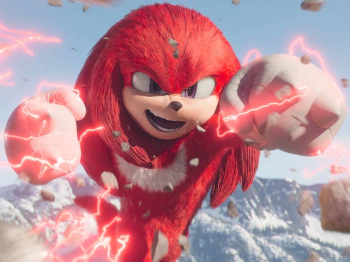 Knuckles from Sonic the Hedgehog franchise, CGI character leaping with fists charged with energy
