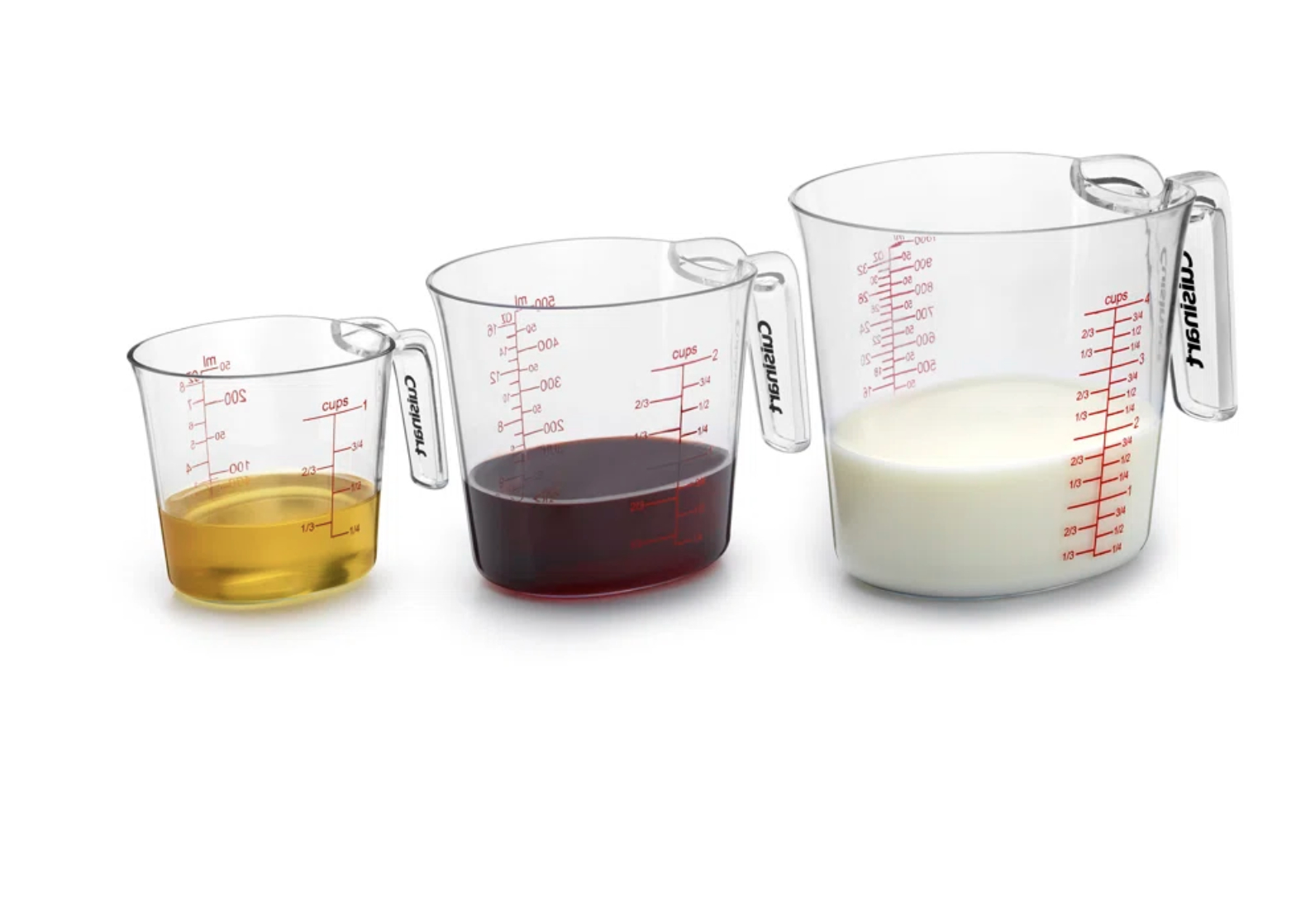 Three measuring cups with different liquid levels for shopping