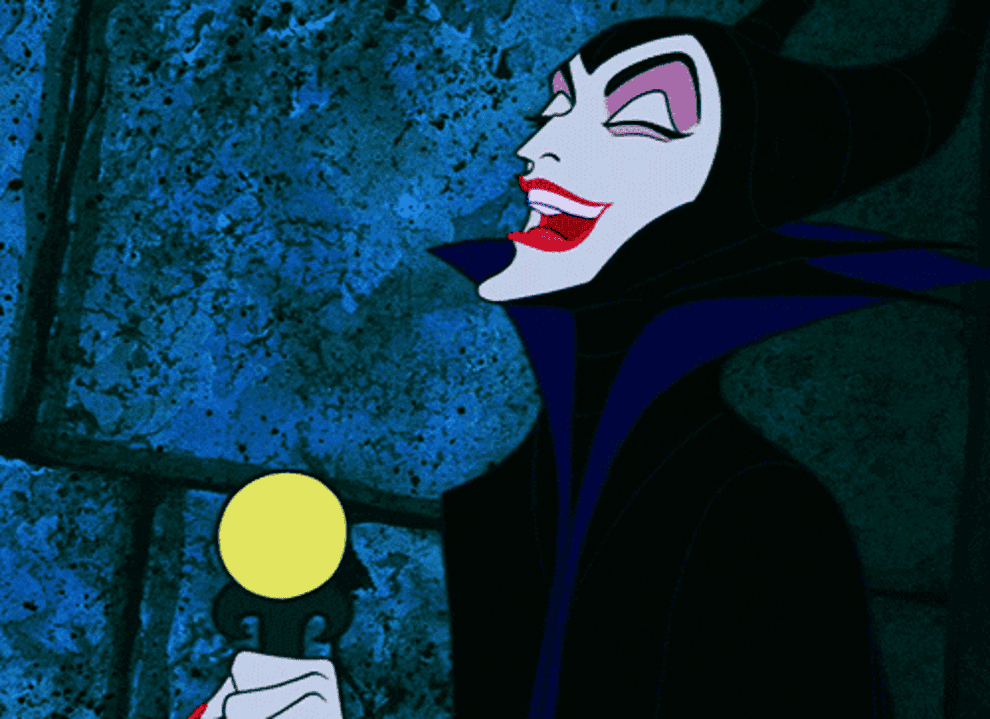 Maleficent from Sleeping Beauty holding a glowing orb with a sly expression