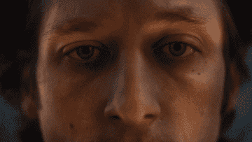 Close-up of an unidentified person&#x27;s face looking into the camera