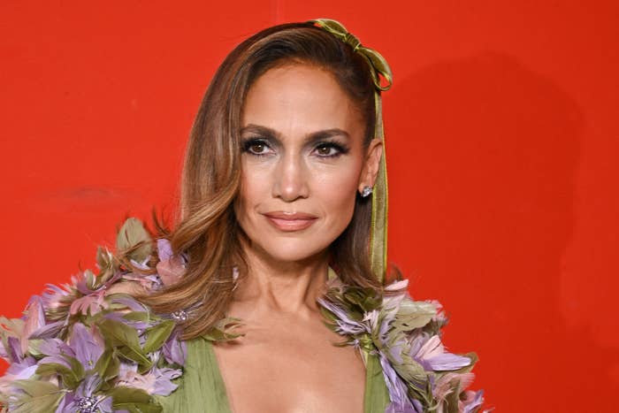 Jennifer Lopez in a dress with floral accents at an event