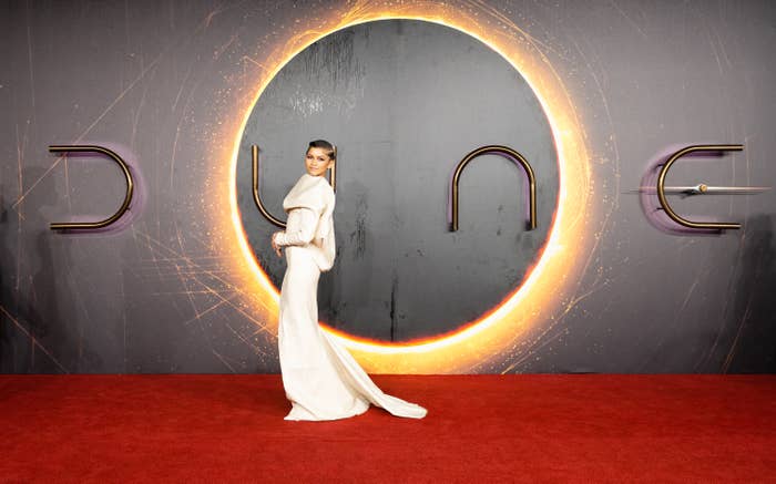 Zendaya stands on the &#x27;Dune&#x27; premiere red carpet in an elegant gown with a train