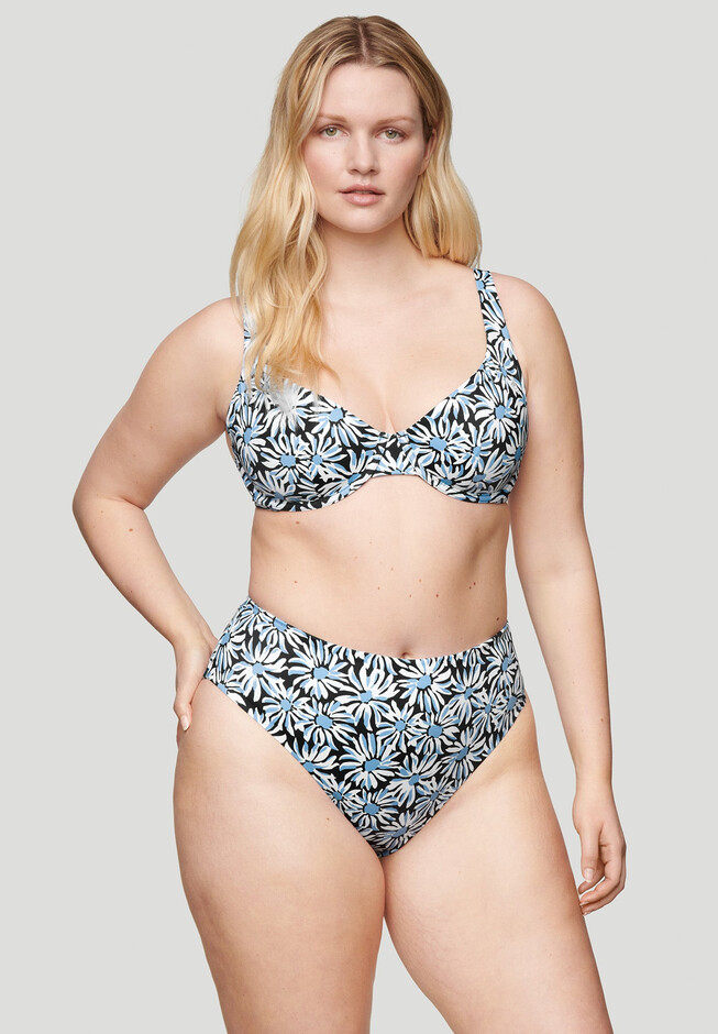 Model wearing a patterned two-piece swimsuit designed for plus-size shoppers