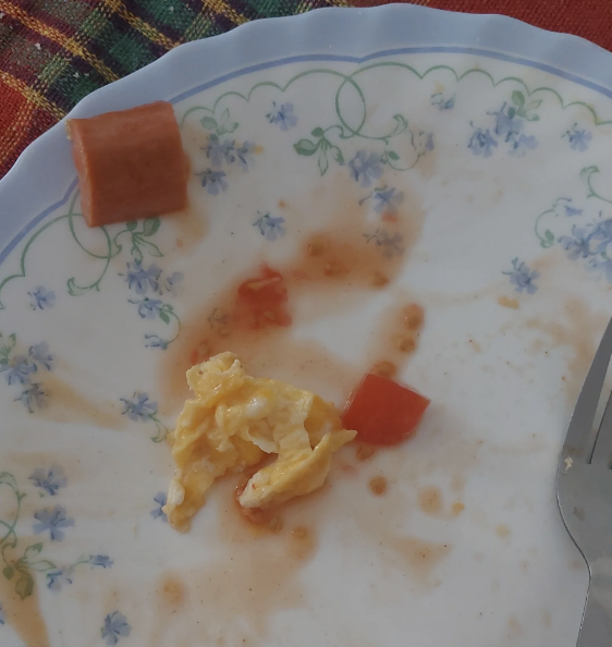 A plate with leftover food suggesting a meal shared between partners