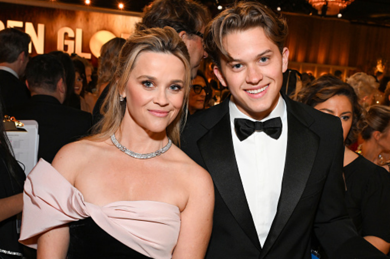 Reese Witherspoon and son Deacon Phillippe at an event, both in formal attire with Reese in a strapless dress