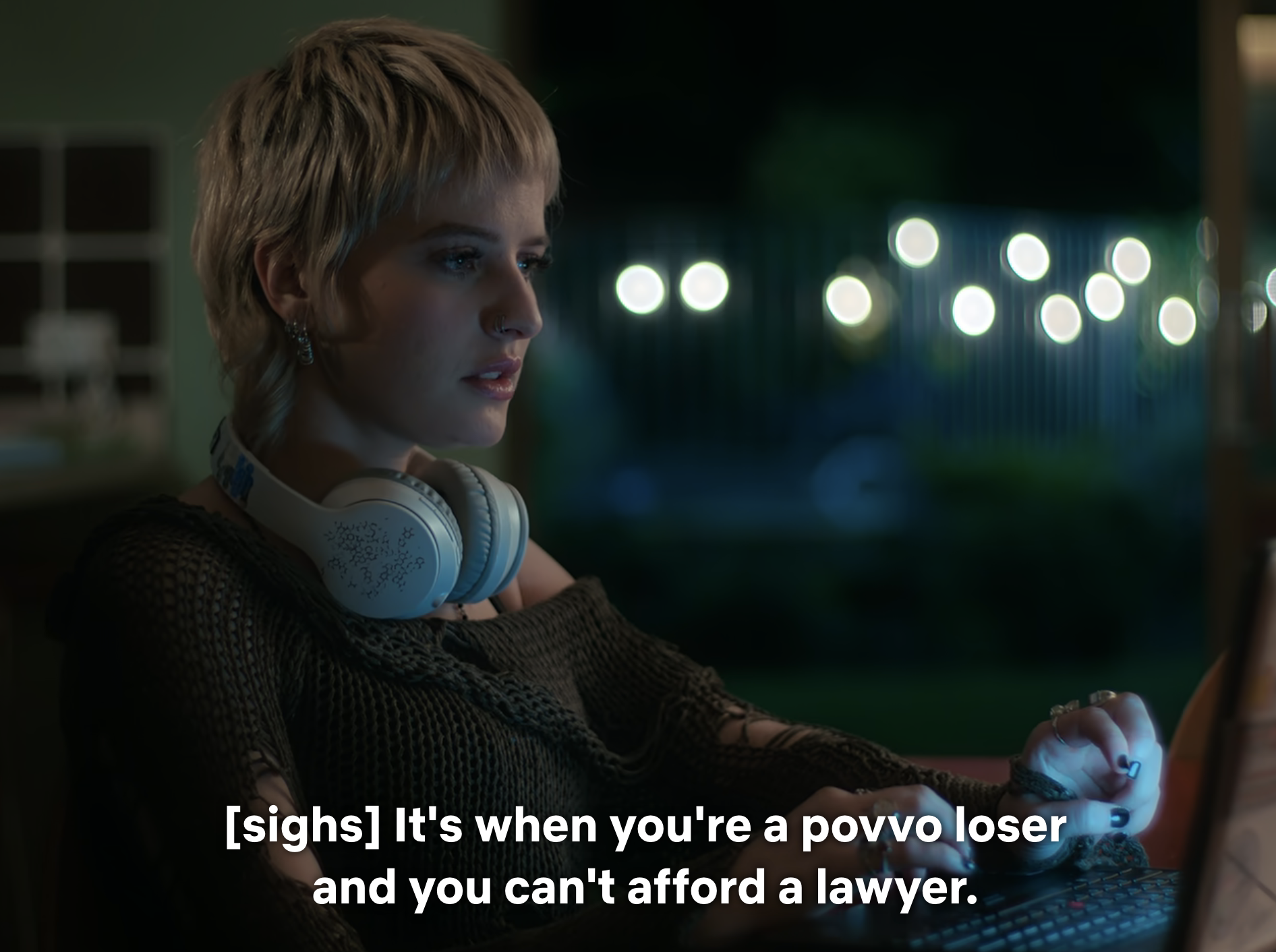 Woman with short hair wearing headphones looks contemplative with subtitle about affording a lawyer