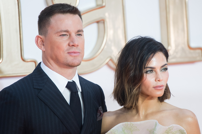 Channing Tatum and Jenna Dewan at an event, wearing a suit and an embroidered gown respectively