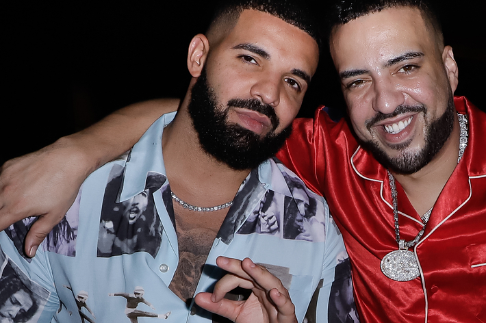 Drake and French Montana posing together, Drake in printed shirt and French in red satin jacket