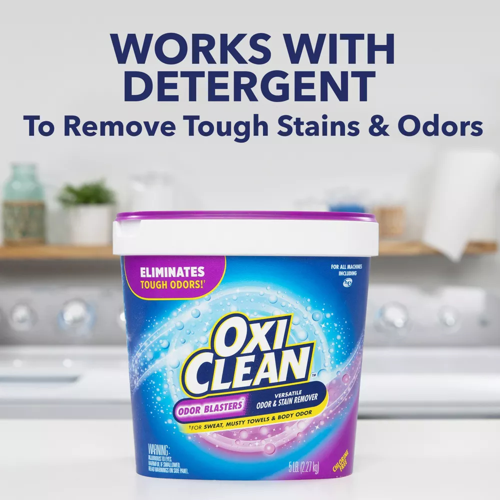 Container of OxiClean detergent on countertop advertising stain and odor removal