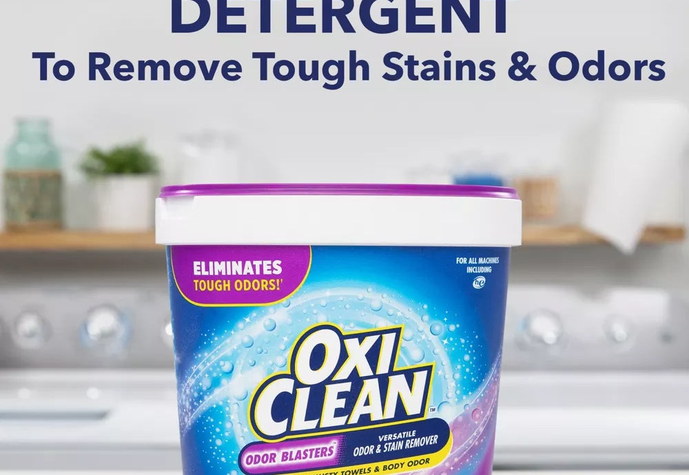 Container of OxiClean detergent on countertop advertising stain and odor removal