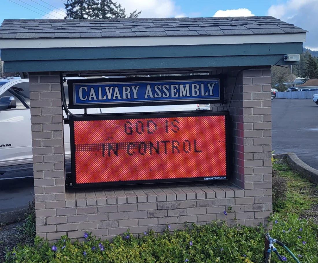 Electronic sign outside Calvary Assembly reads &quot;GOD IS IN CONTROL&quot; in capital letters