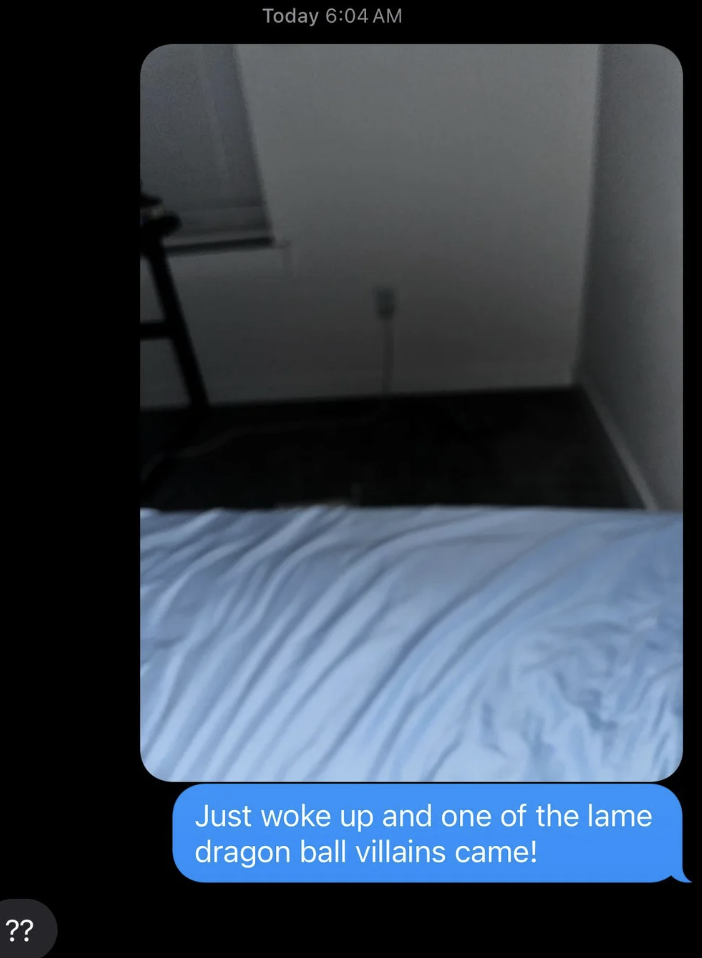 A dimly lit room with a bed in the foreground and a figure resembling a &#x27;Dragon Ball&#x27; character edited into the scene. Text overlay denotes surprise at the visit