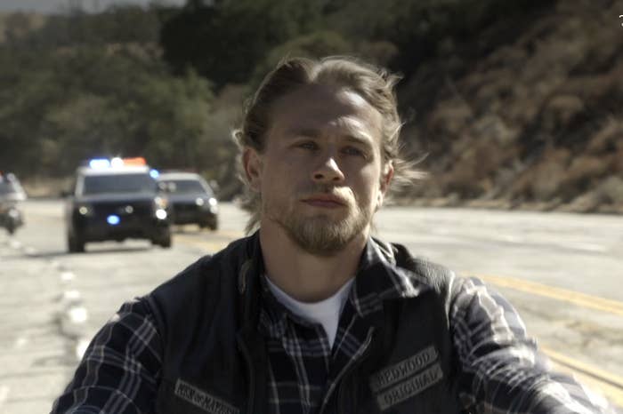 Jax Teller on his bike being pursued by police on the highway