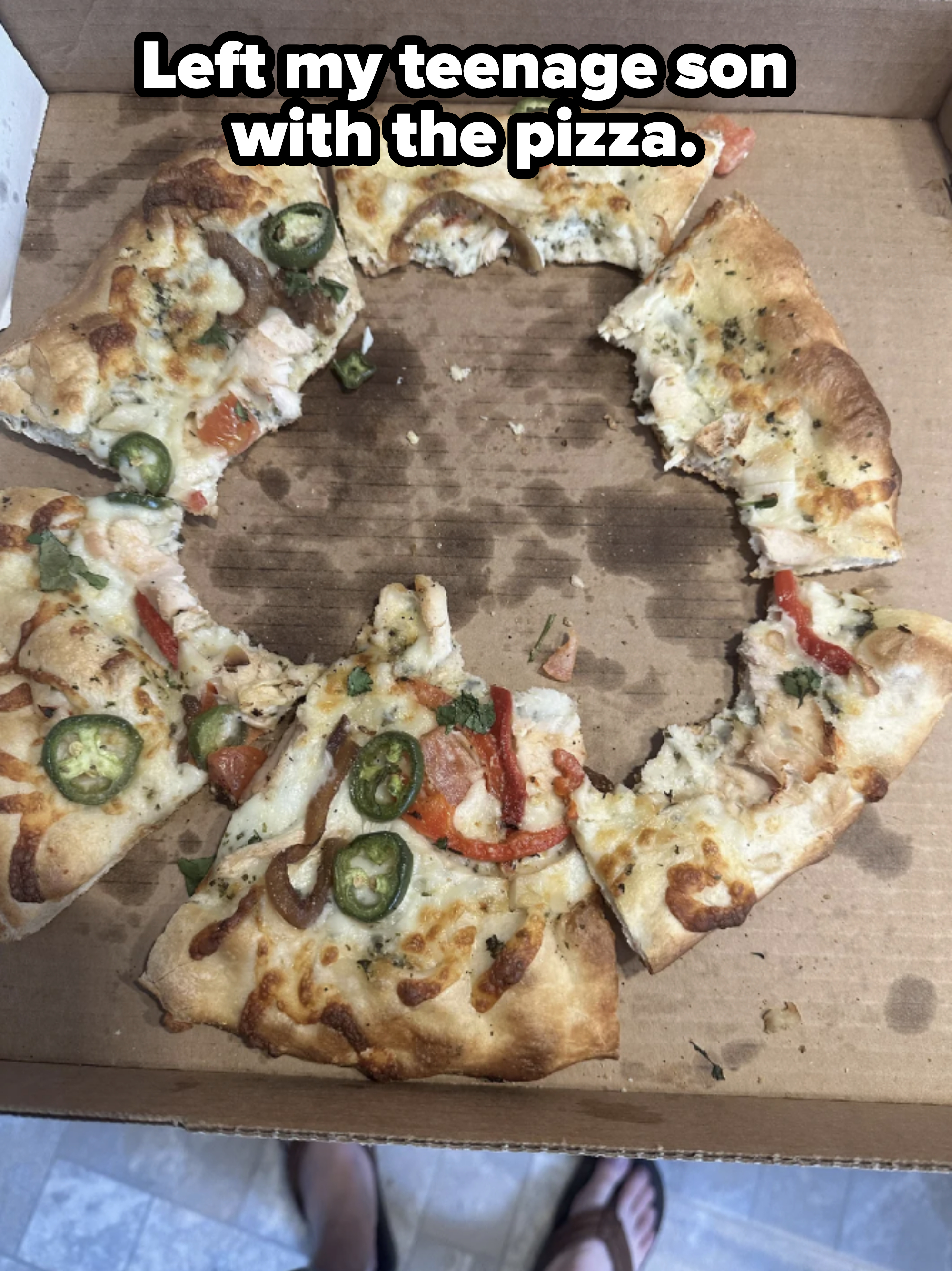 Photo of a half-eaten pizza with middle cut out saying teenage son ate it