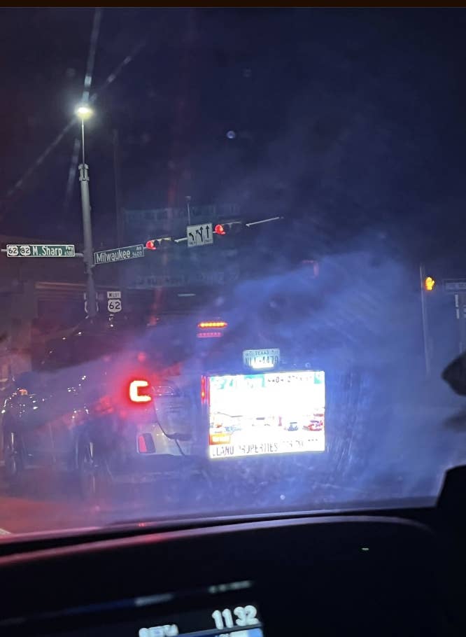 A giant screen on the back of someone's car