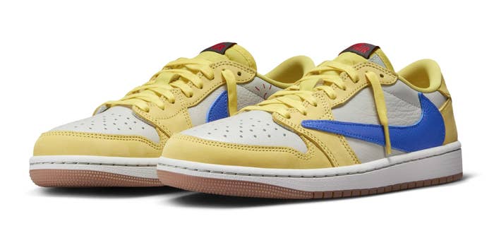 A pair of yellow and blue sneakers with red accents on a white background