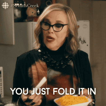 Moira from "Schitt's Creek" frustratedly explains folding in a cooking scene