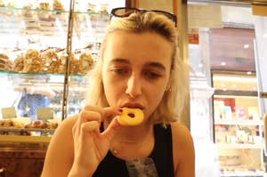 Emma Chamberlain eating a cookie