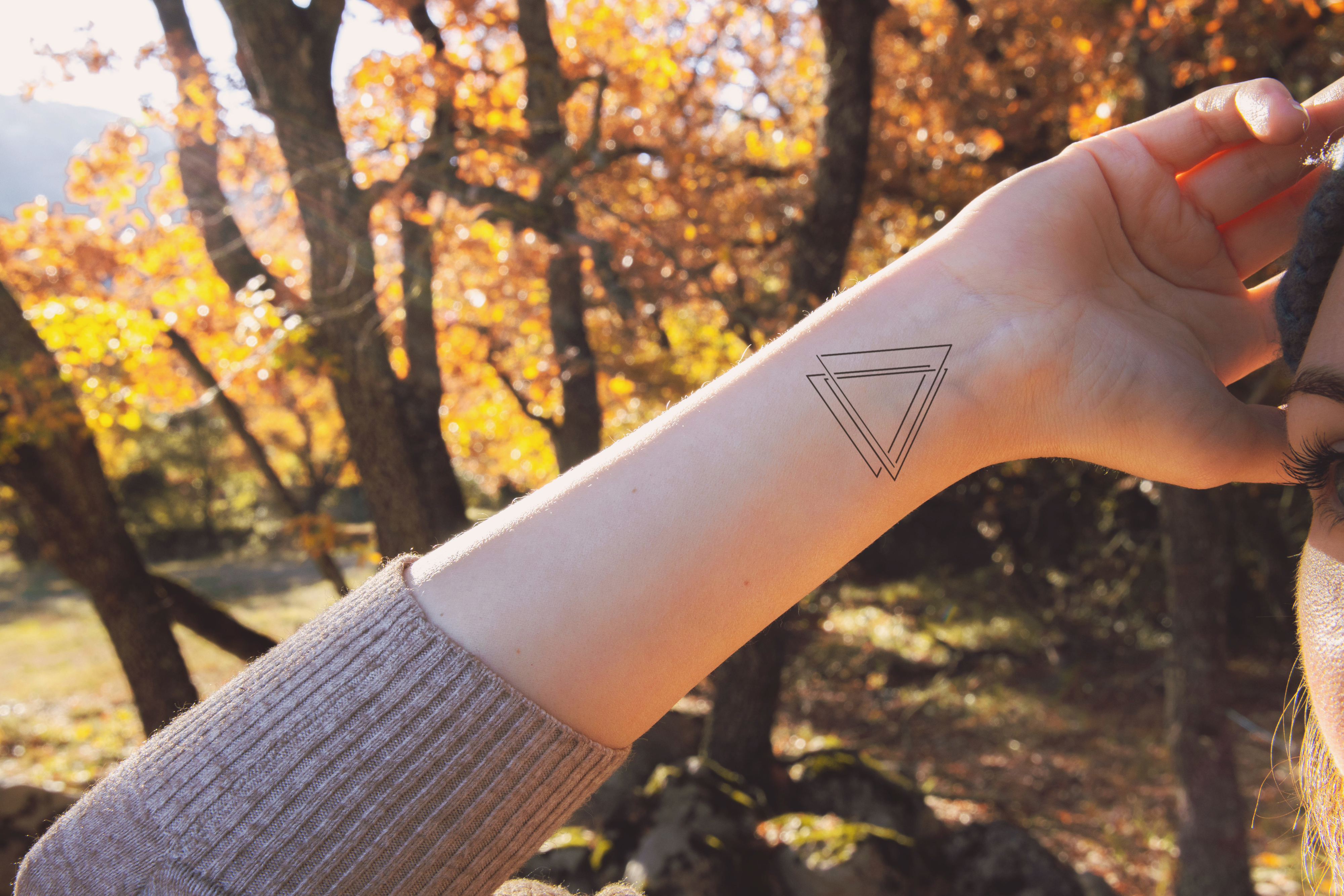 small geometric tattoo on a woman&#x27;s wrist
