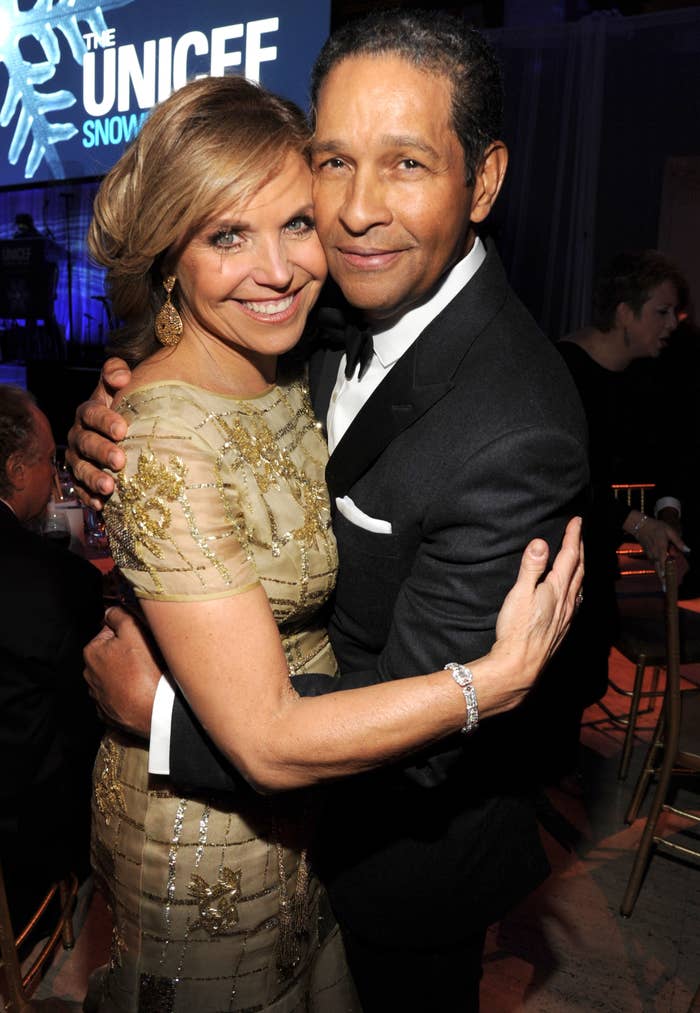 Closeup of Katie Couric and Bryant Gumbel hugging