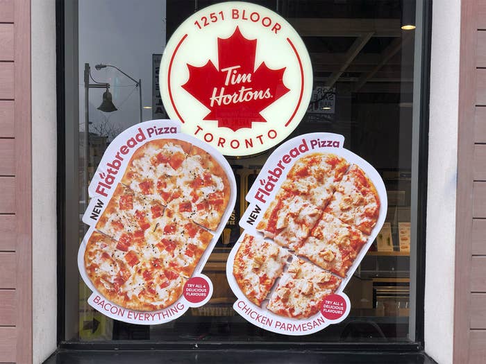 Ad for Tim Hortons&#x27; flatbread pizzas, featuring Bacon Everything and Chicken Parmesan options