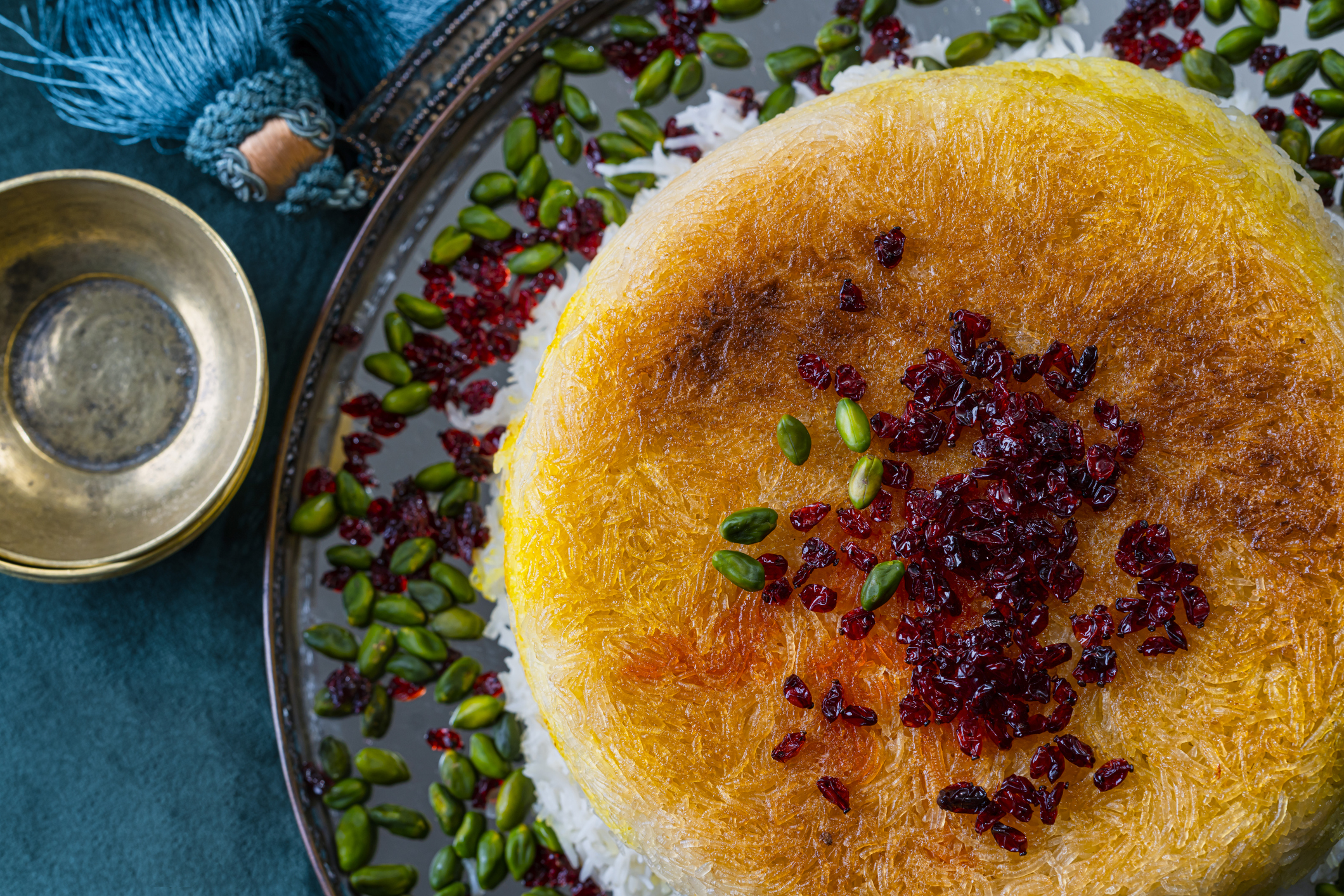 A plate of Persian rice with barberries and pistachios, traditional garnishes