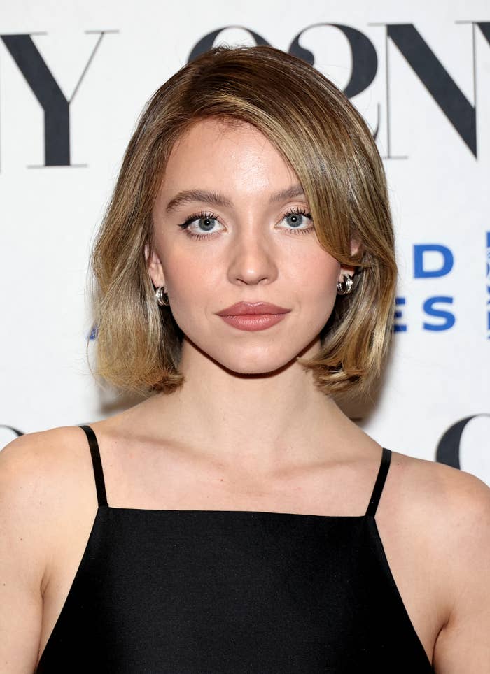 Sydney Sweeney wearing a black dress at an event