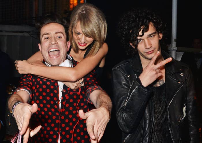 Taylor Swift and Matty Healy with British DJ Nick Grimshaw